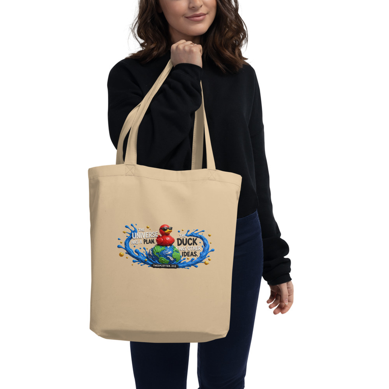 Model carrying an oyster eco tote with The Universe Has a Plan and the Cosmic Duck artwork