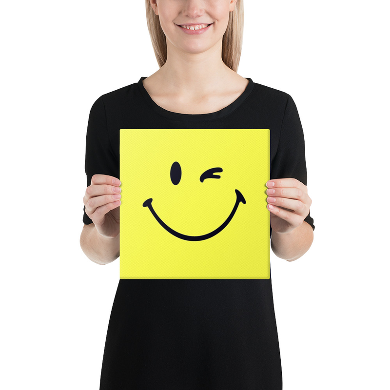 Bright yellow canvas print featuring a bold, minimalist winking smiley face artwork
