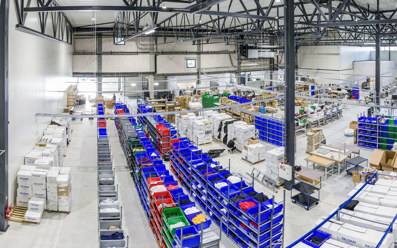 Print on Demand isn't a silver bullet, but it addresses one of the fashion industry's biggest structural problems: overproduction. By printing only after a customer orders, POD removes the speculative inventory cycle that drives so much textile waste. Made-to-order means no overproduction Traditional fashion production starts with forecasts – a brand estimates how many units will sell, then manufactures bulk inventory, hoping it clears. When it doesn't, leftovers head to landfills, incinerators, or deep-discount racks. Up to 21% of newly created garments go unsold each year – a staggering waste of materials, labor, and energy. Made-to-order flips the model. Products enter production only after a sale, which means fewer resources spent on items nobody buys, no surplus inventory, and no clearance fire sales. For merchants, that translates to lower upfront risk. For the planet, it means less new clothing produced just to sit in a warehouse before being thrown out. Local fulfillment lowers the shipping footprint A custom hoodie shipped from a fulfillment facility in the same country as the buyer travels a fraction of the distance of one shipped from the other side of the world. POD networks match orders to nearby Print Providers whenever possible, cutting transport emissions, fossil fuels burned in long-haul logistics, and the greenhouse gases that come with international air freight. It also shortens the product's life cycle from order to delivery. Printful uses on-demand manufacturing across multiple in-house facilities to reduce shipping distances and improve fulfillment speed – making local delivery a structural advantage of the model, not an optional add-on. The limits POD alone doesn't solve POD makes a real dent in overproduction, but it doesn't make every product automatically sustainable. The model still has real limits worth being honest about: Material choices. A POD platform offers blanks across the spectrum – conventional cotton, polyester blends, and certified organic cotton or recycled polyester. Choosing the right base matters. Printing methods. Some printing techniques use water-based inks (lower-impact), others use plastisol or solvent-based inks (higher-impact). The print itself can undo the gains of an organic blank. Packaging. Plastic mailers and over-packaged orders add to the textile industry's plastic footprint. Recycled or recyclable packaging makes a difference. Returns and waste. Even on-demand orders get returned, and returned apparel often ends up in landfills. End-of-life impacts. Once the garment leaves the customer's closet, it still needs somewhere to go – donation, resale, recycling, or, unfortunately, the bin. POD reduces overproduction. It doesn't replace responsible material sourcing, ethical production practices, or thoughtful design. Merchants who treat POD as the start of the work – not the finish – build the strongest sustainable fashion brands. Sustainable fashion practices POD sellers can adopt today