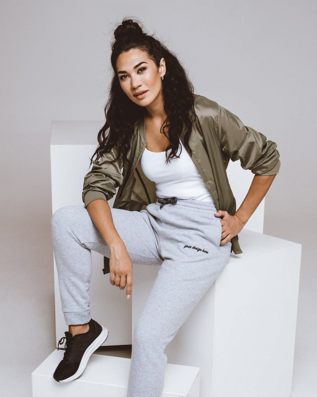 Girl sitting while wearing custom joggers