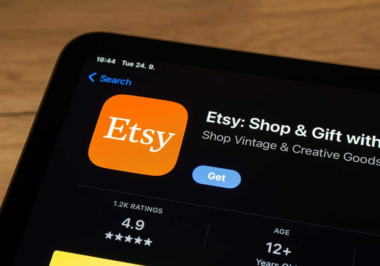 A close-up shot of a smartphone with the Etsy app on the screen.