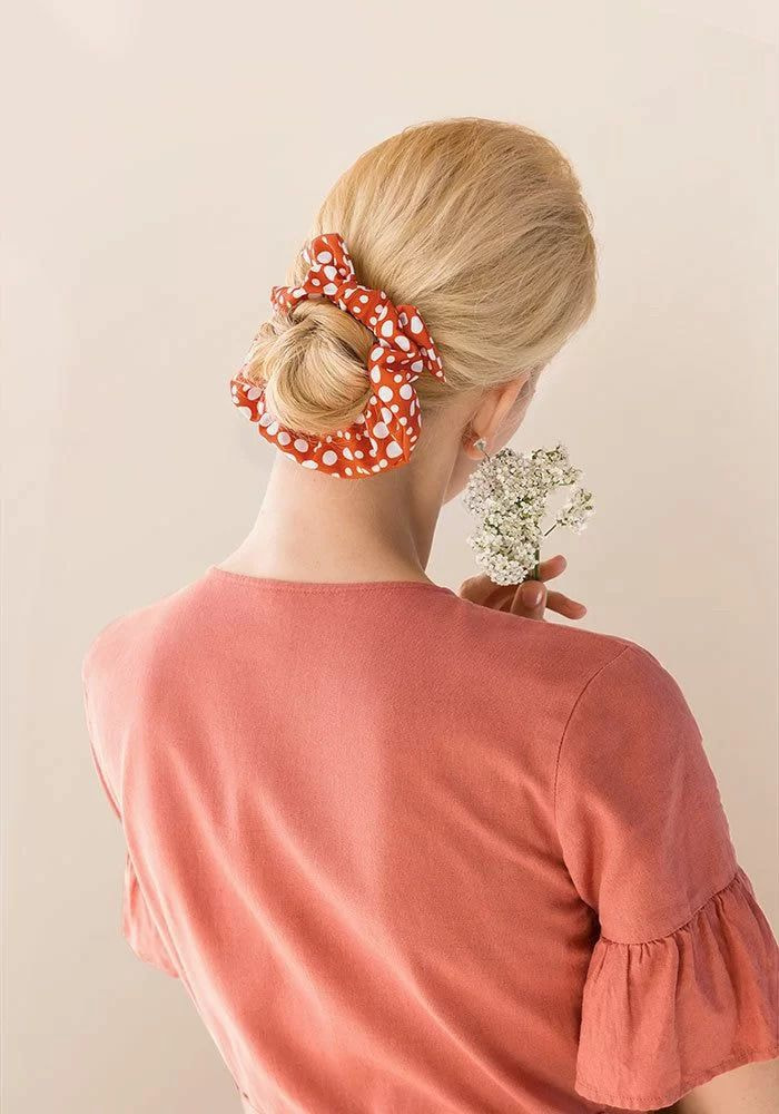 a woman with a flower in her hair