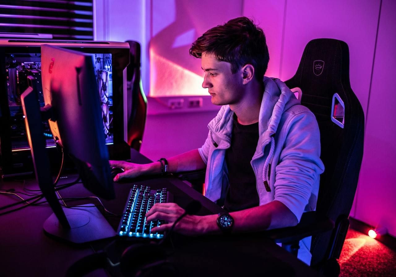 A person gaming on a computer.