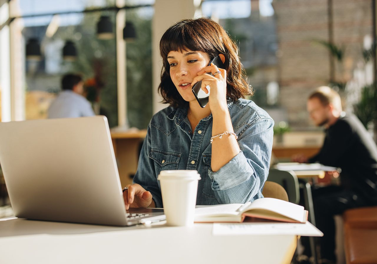 A woman is talking on the phone