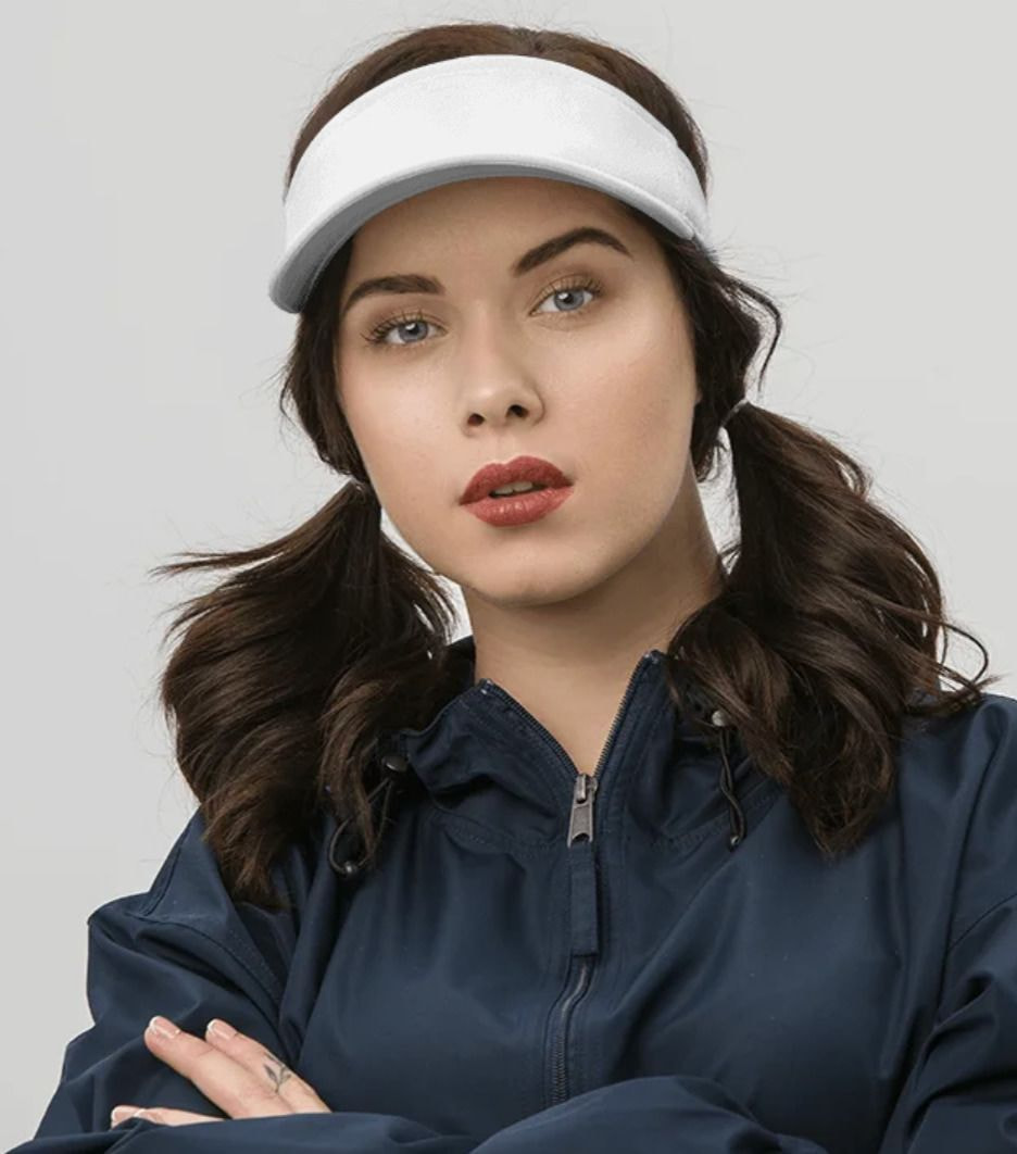 a woman wearing a white visor