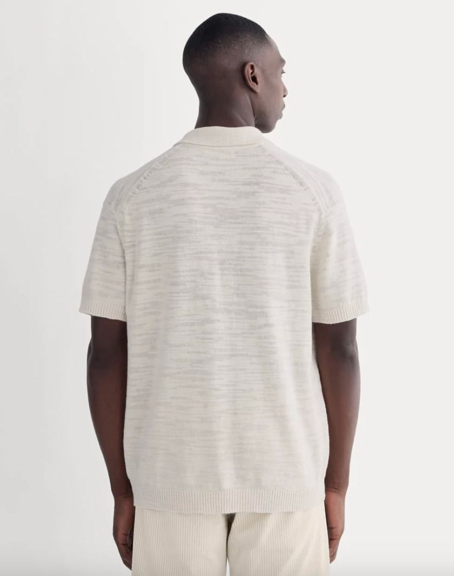 A man is wearing Everlane t-shirt.