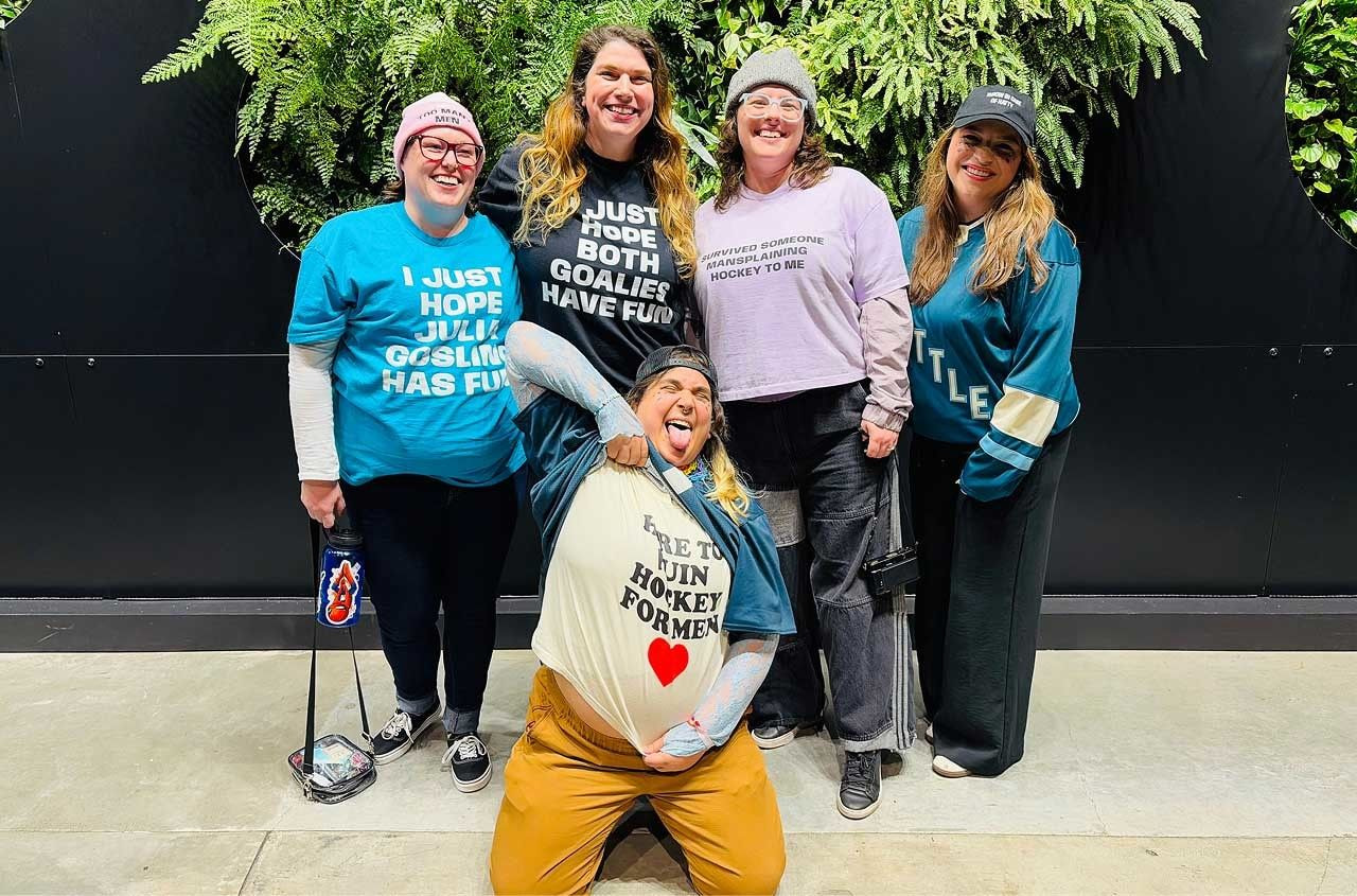 a group of women posing for a photo