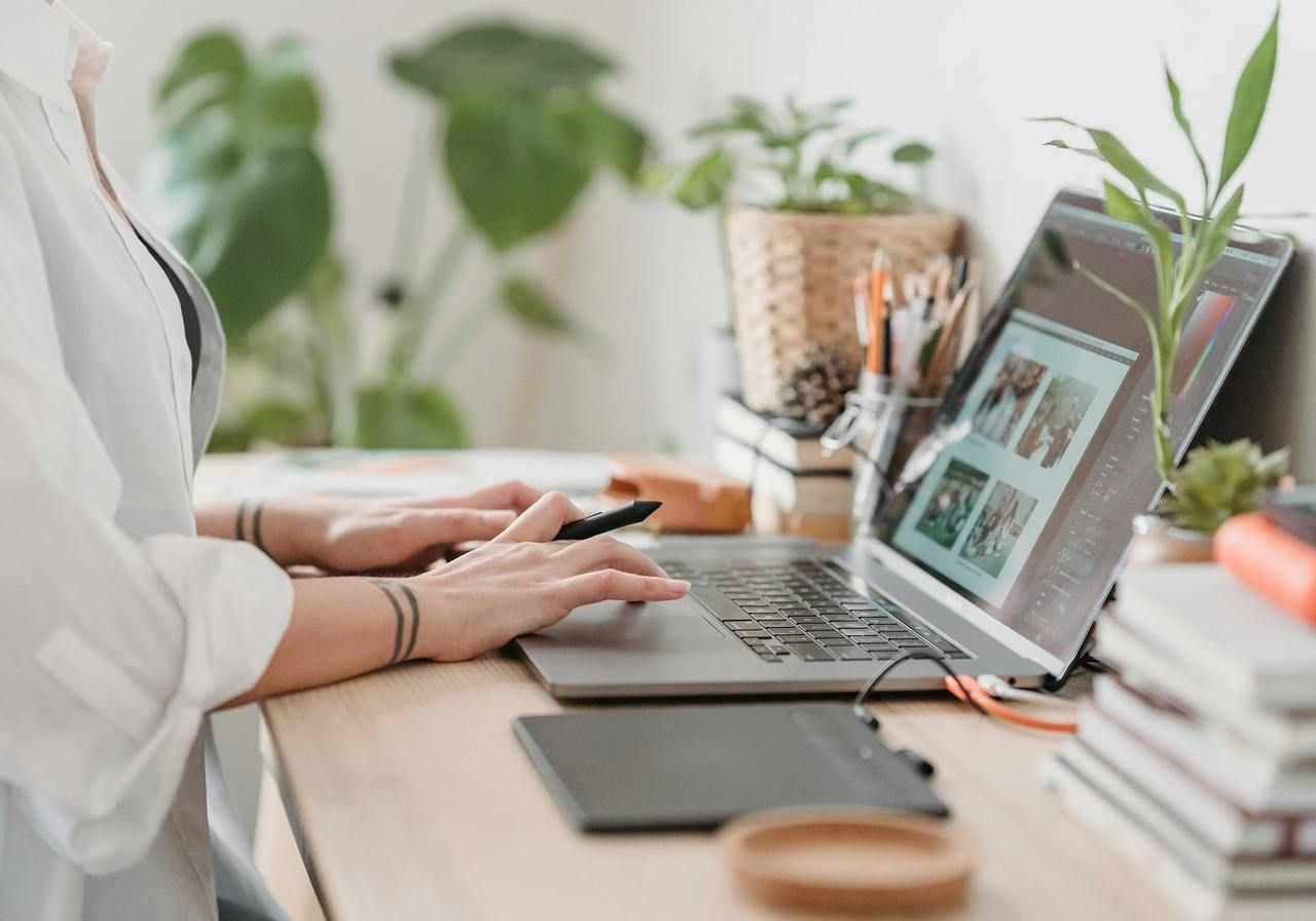 A person working on a laptop.