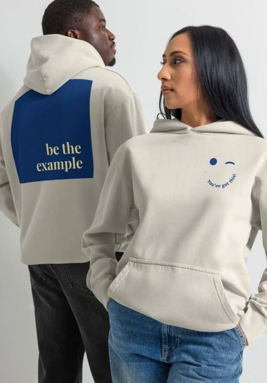 a man and woman wearing hoodies