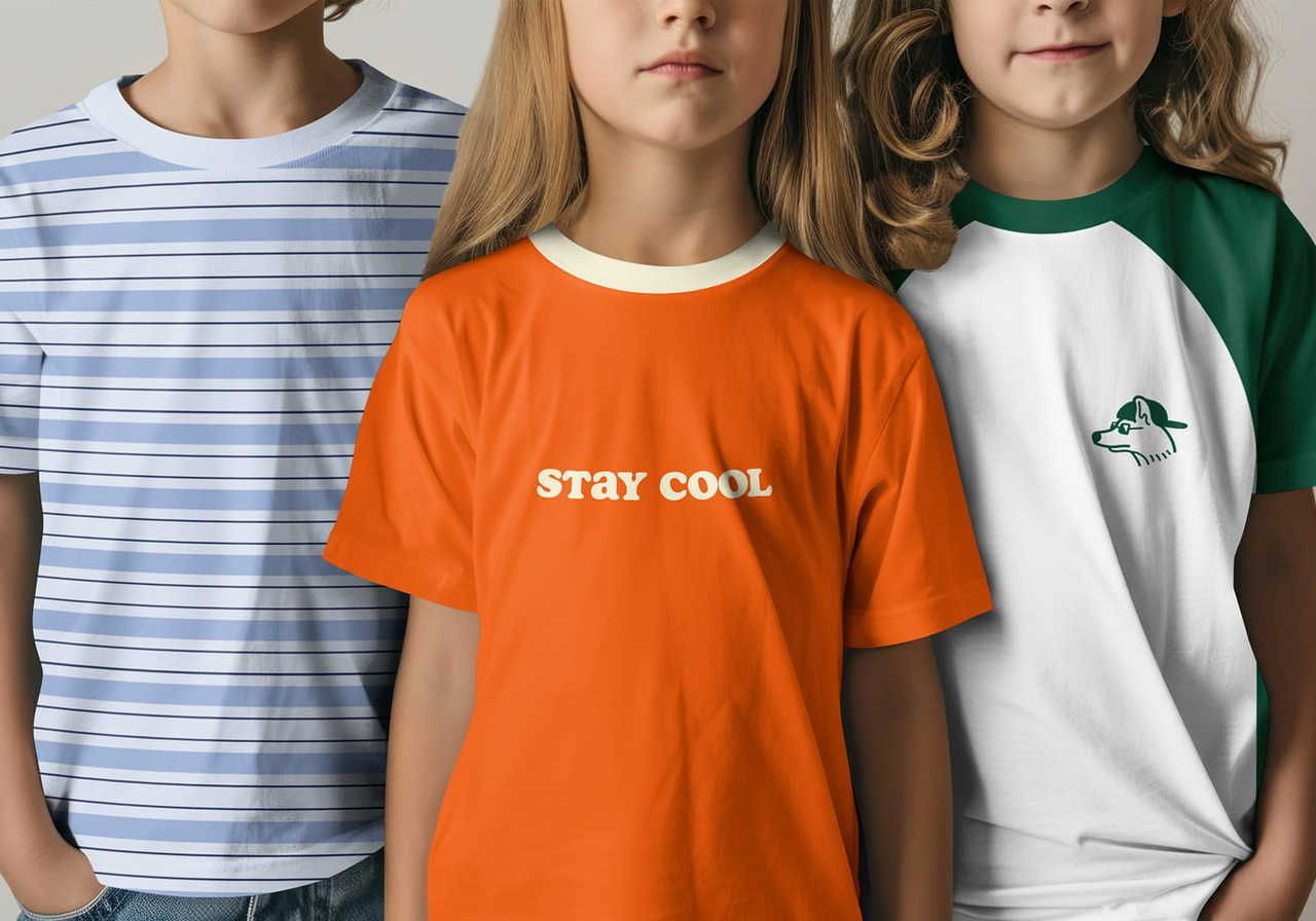 Three children wearing t-shirts. First has blue stripes, the second is orange with "STAY COOL", and the third is white and green with a wolf logo.
