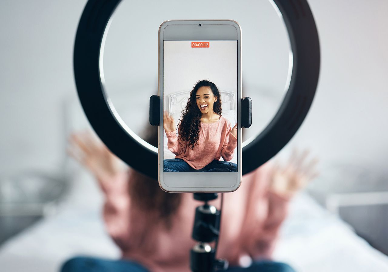 An influencer is filming a video.