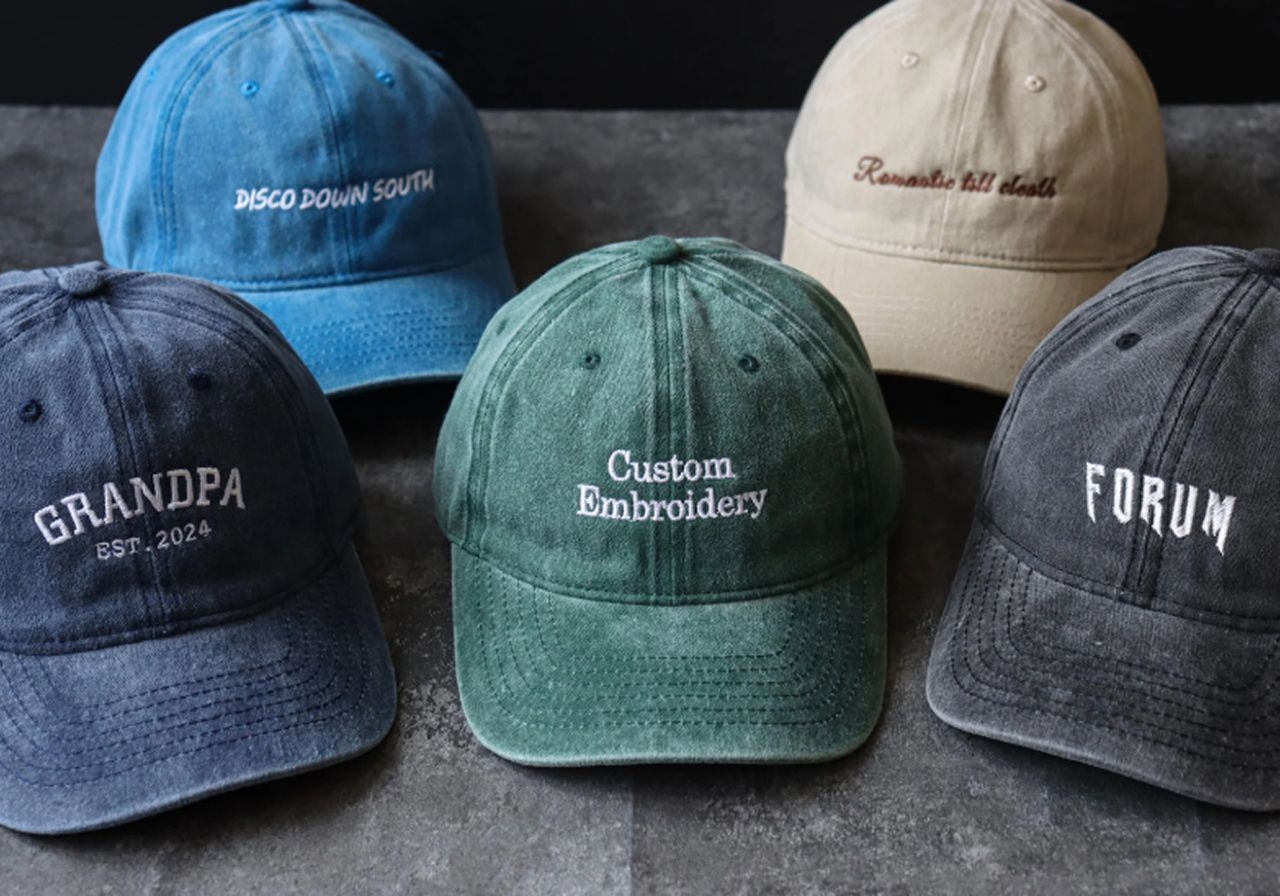 Six hats displayed, labeled with different words in various styles and colors.