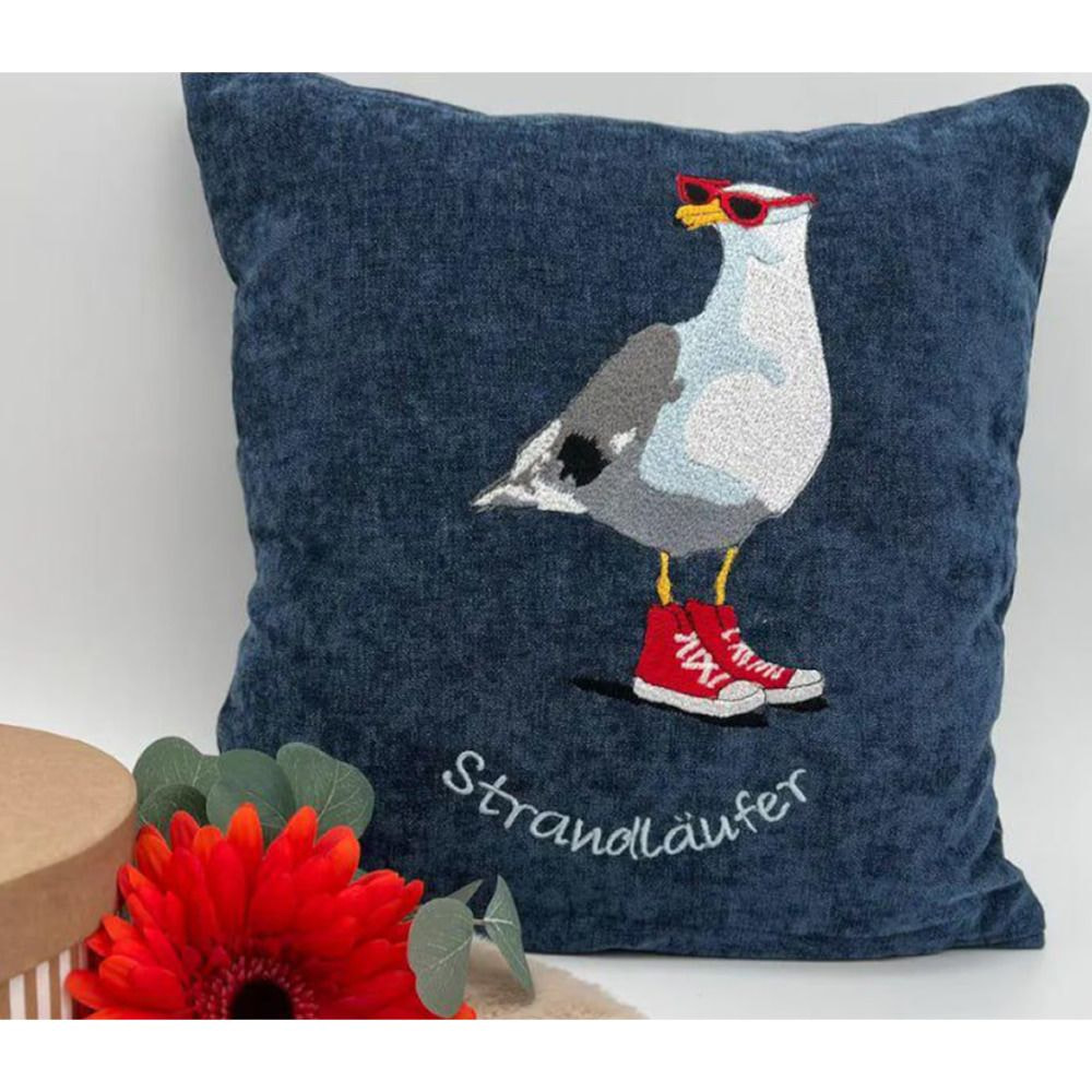 A pillow featuring a seagull in red shoes.