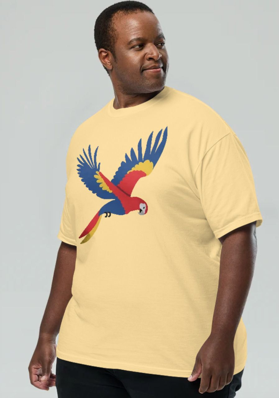a man wearing a yellow shirt with a parrot on it