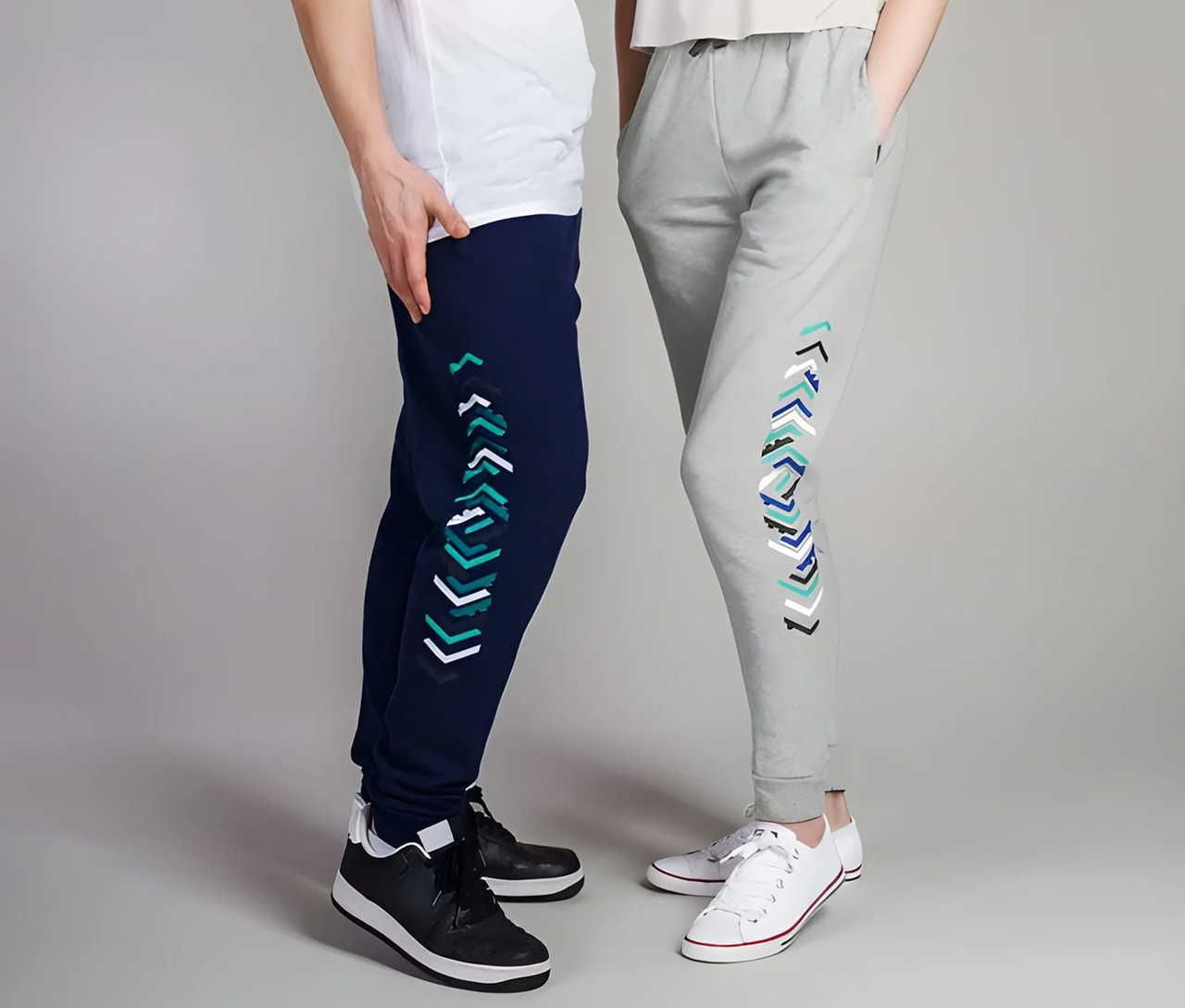 2 individuals, 1 wearing navy blue jogger pants and the other light gray jogger pants, featuring colorful geometric patterns on the sides.