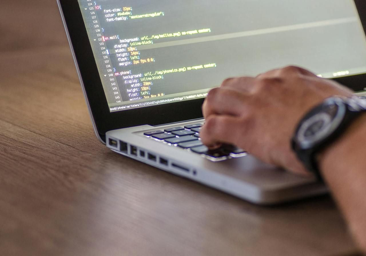 Person coding on a computer.