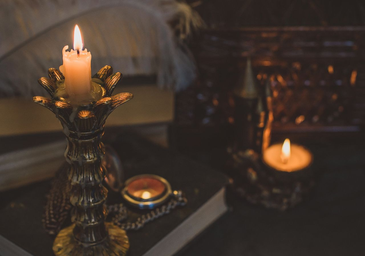 A candle is lit on the table.