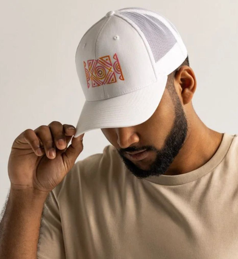 a man wearing a white hat