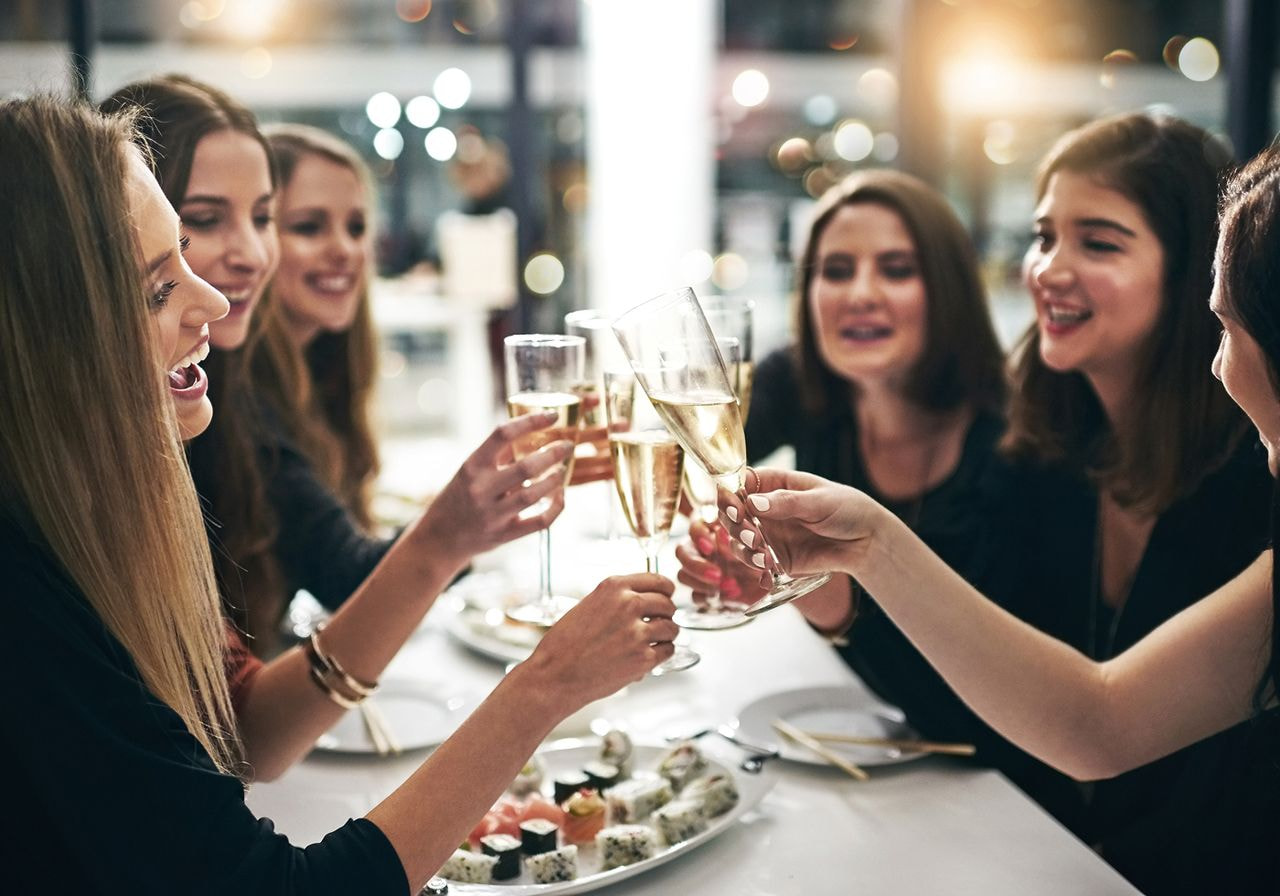 A group of women having dinner.