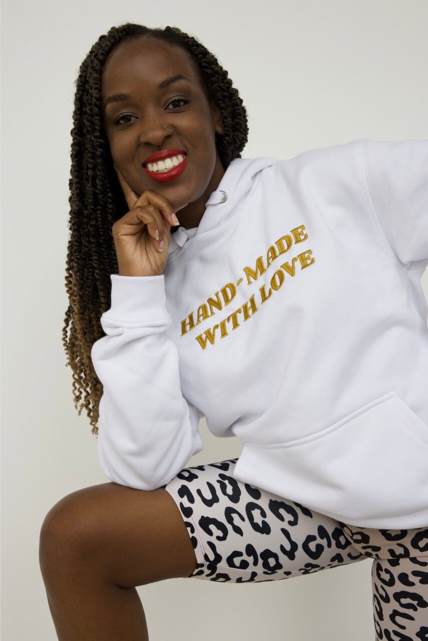 woman wearing an embroidered hoodie