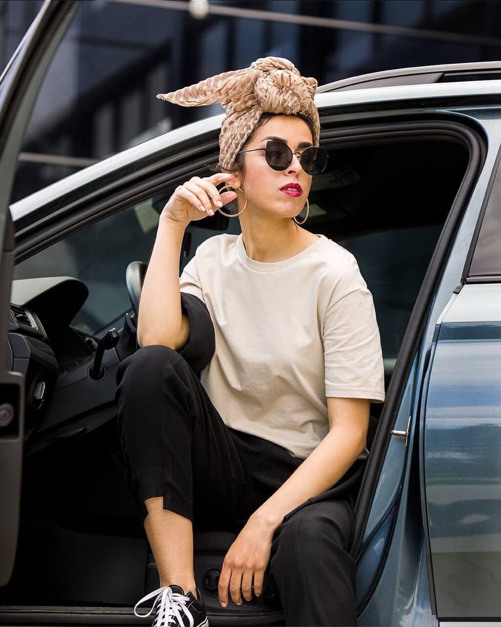 girl with a custom tee sitting in a car