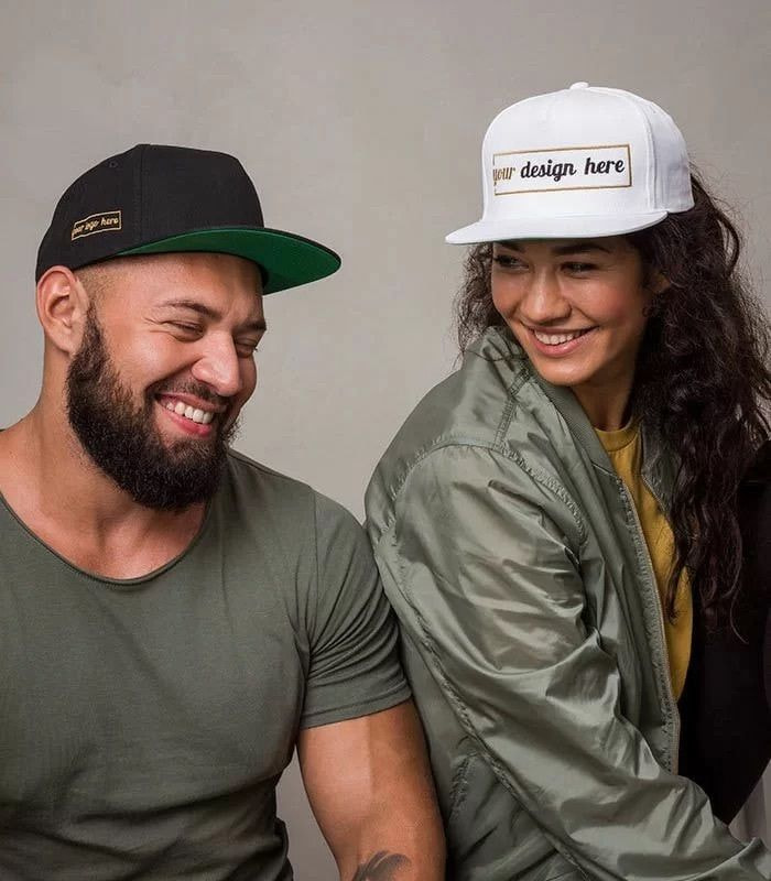 a couple wearing embroidered hats