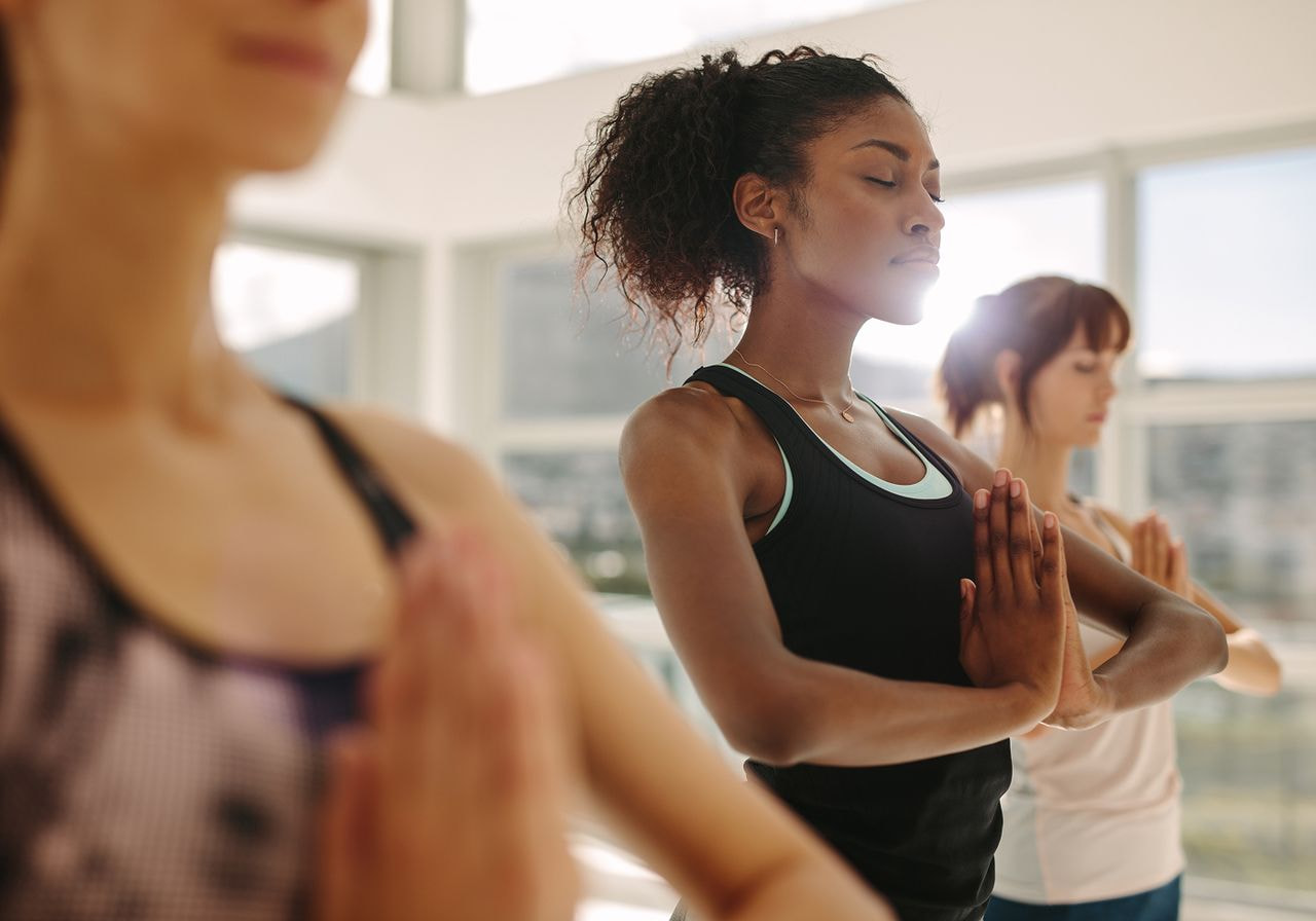 A group of people doing yoga