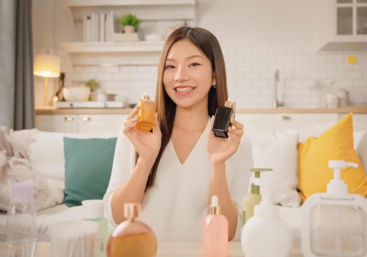 A smiling woman is presenting beauty and health products on TikTok.