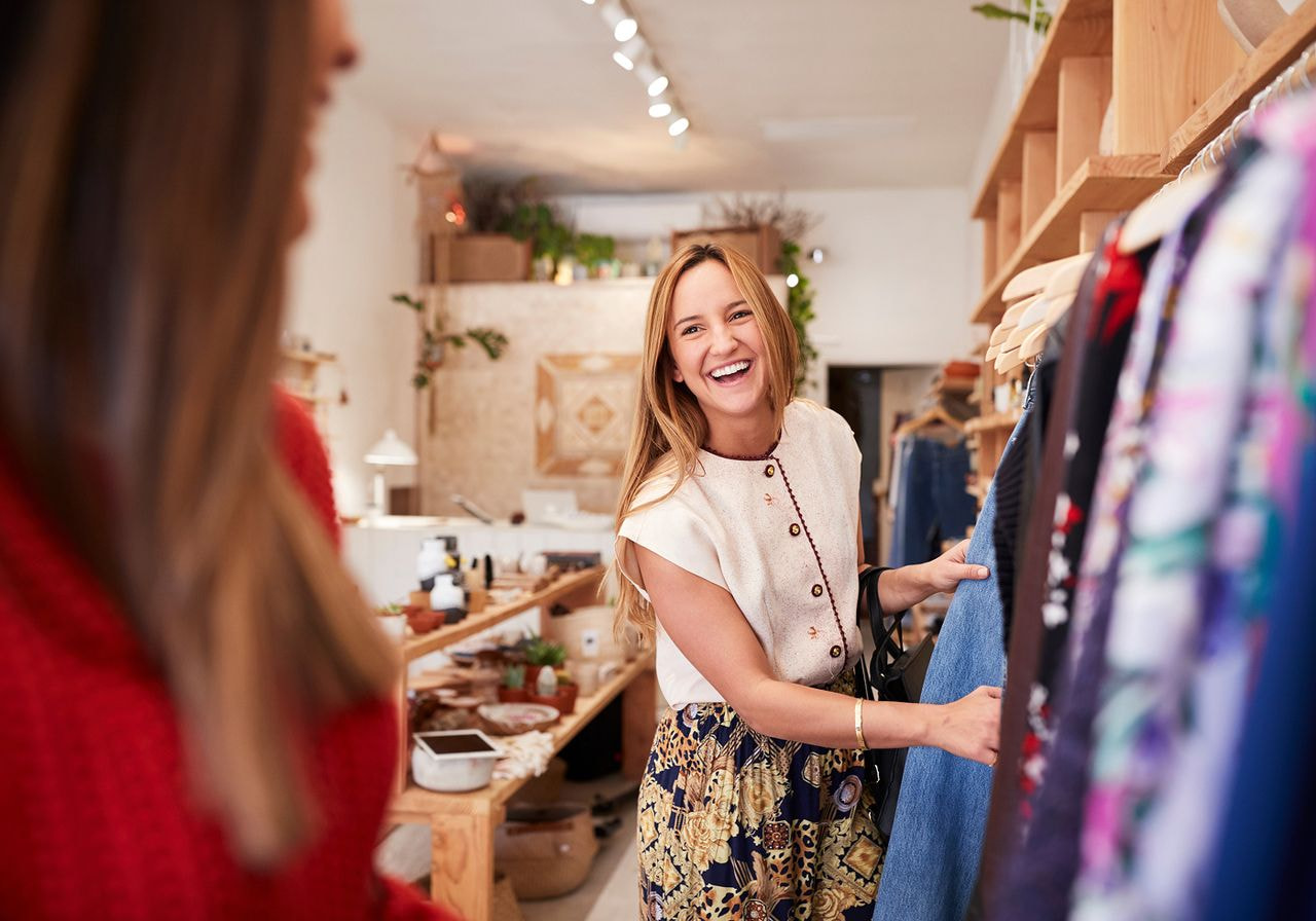 A woman is shopping in a clothing store