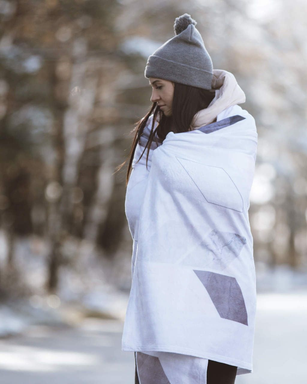 a girl outside with a custom-printed blanket