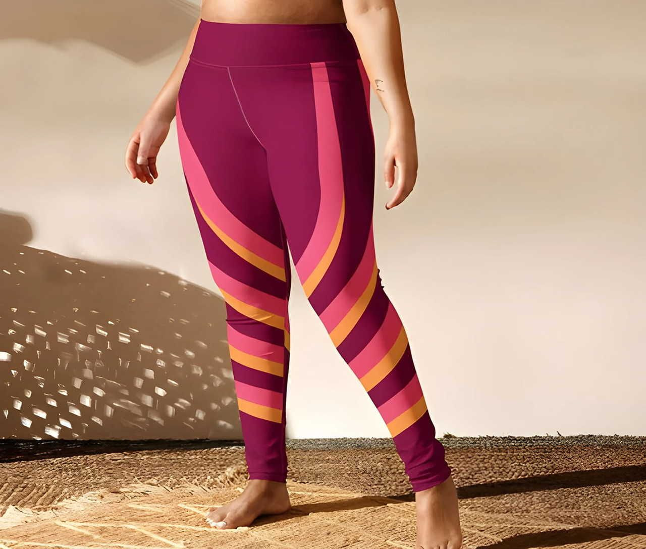 A person wearing colorful, patterned leggings, standing against a neutral background.