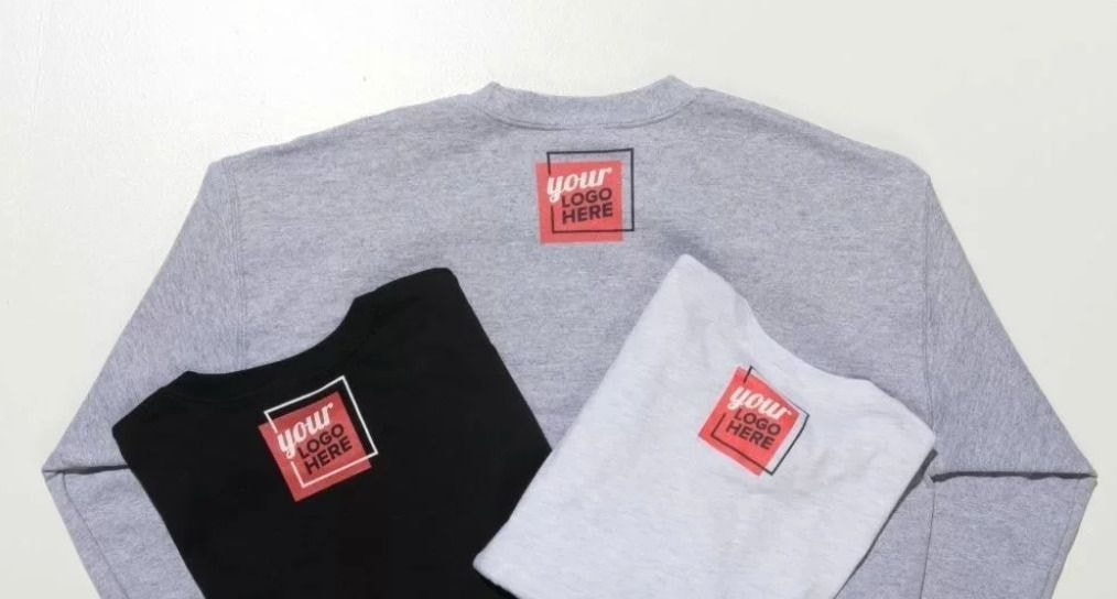 a group of t-shirts with a logo on them