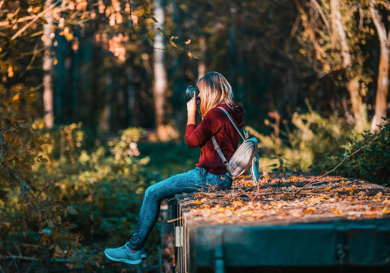 A woman taking a picture.