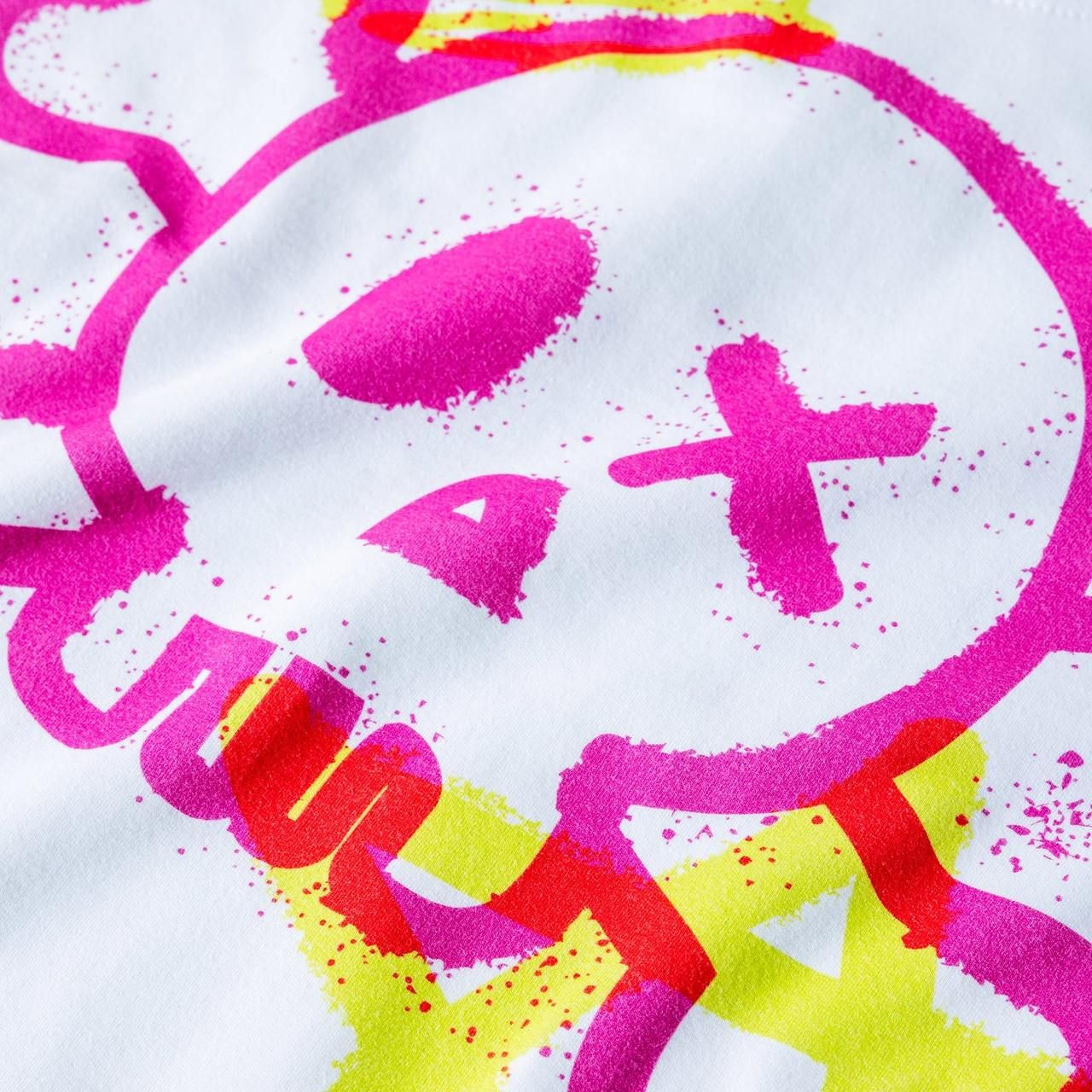 Graffiti-style design on white fabric made with All-Over cotton features a pink skull with an X for one eye.