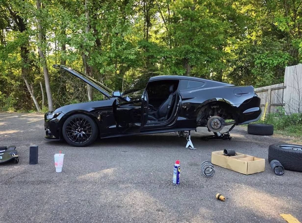 Photo of a car being repaired.