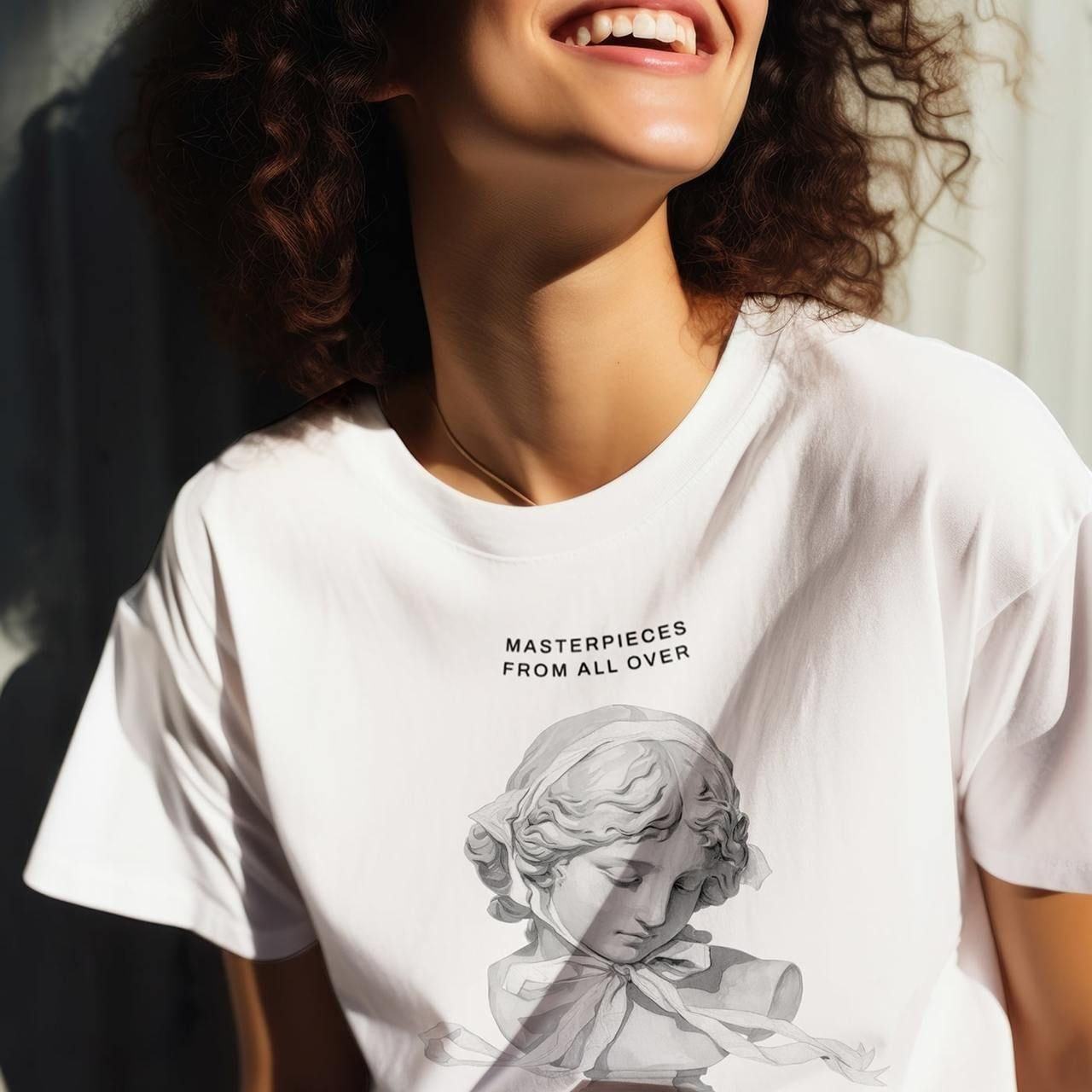 A woman smiles brightly, wearing a white t-shirt featuring a classical sculpture and the words "Masterpieces from All Over."