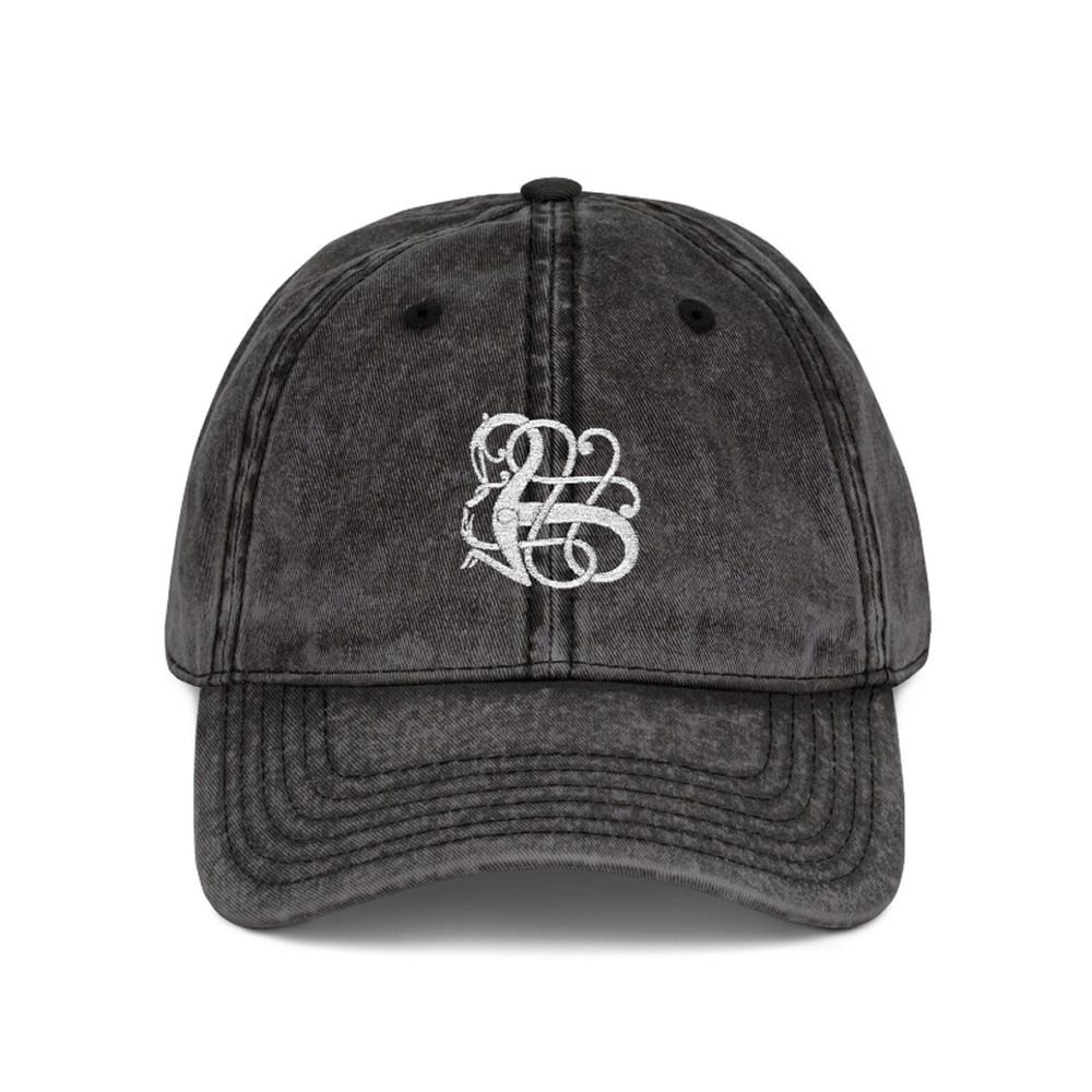 Black baseball cap featuring the initials "B" and "E" prominently displayed on the front.
