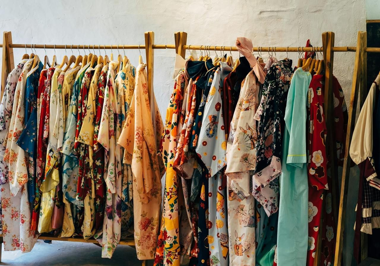 Clothes on a clothing rack.