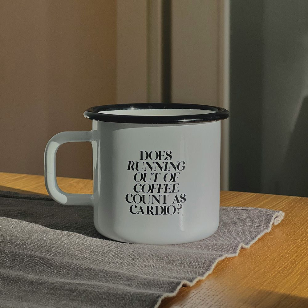 a white mug with black text on it