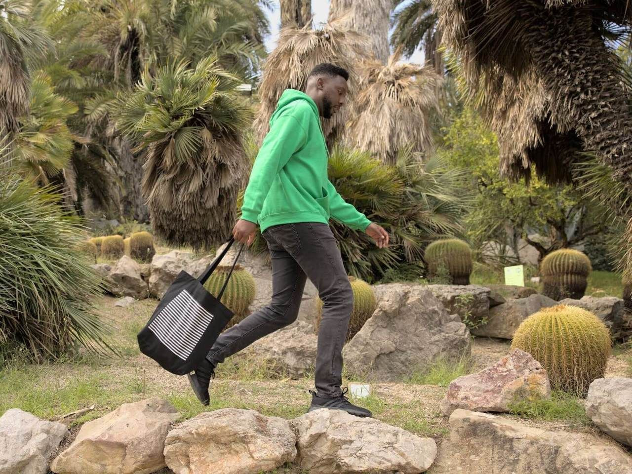 Man in the park carrying organic tote bag