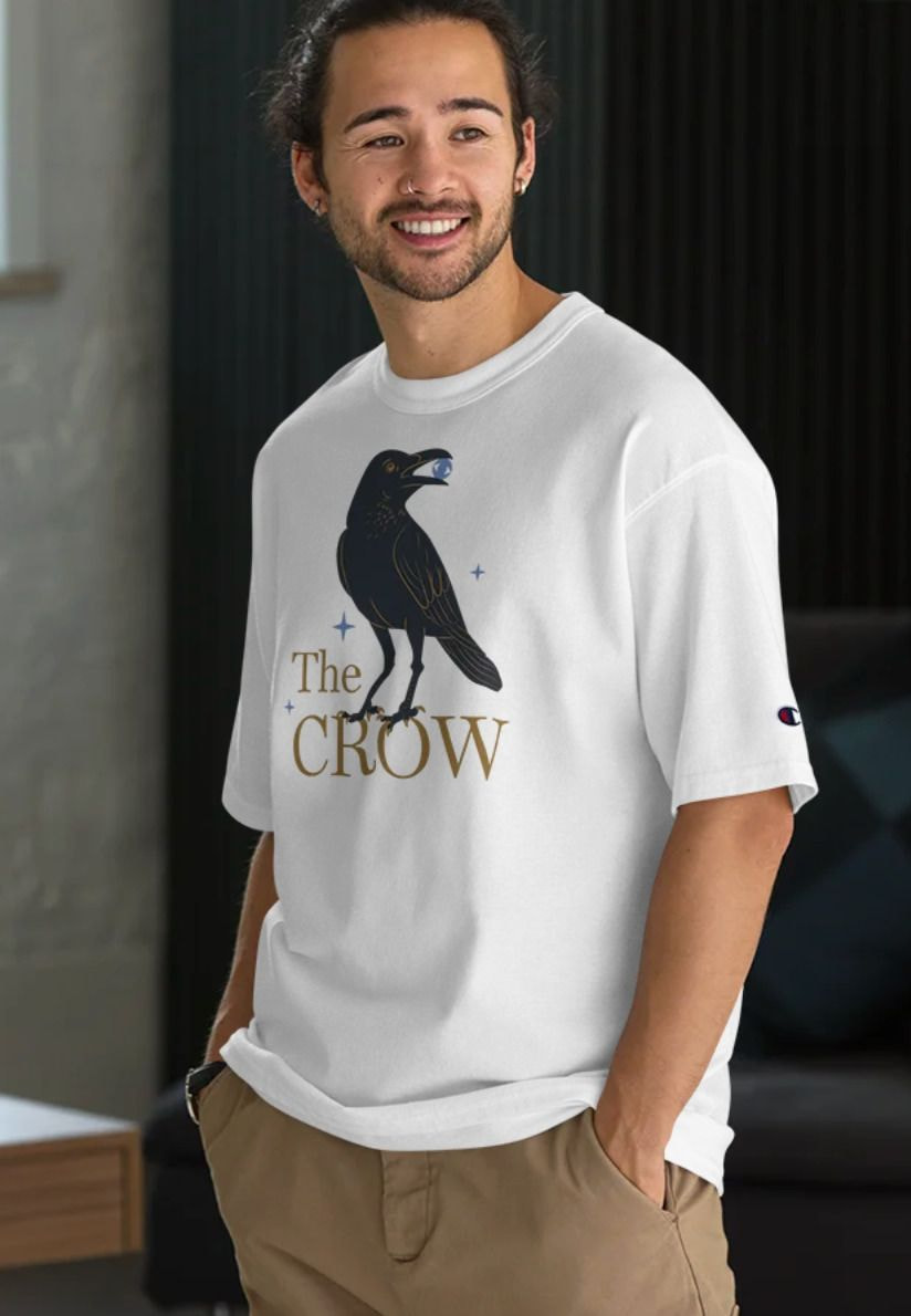 A man is wearing a Champion t-shirt.