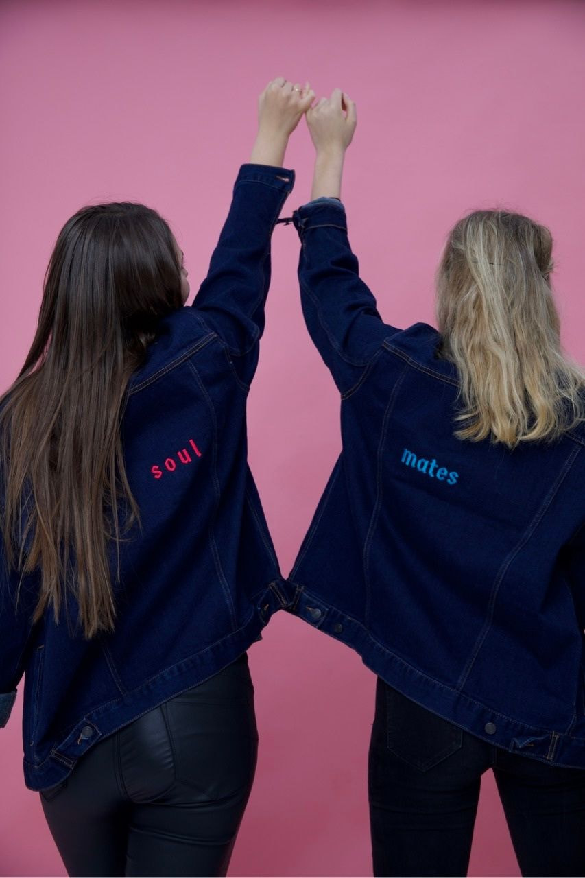 two girls wearing custom denim jackets