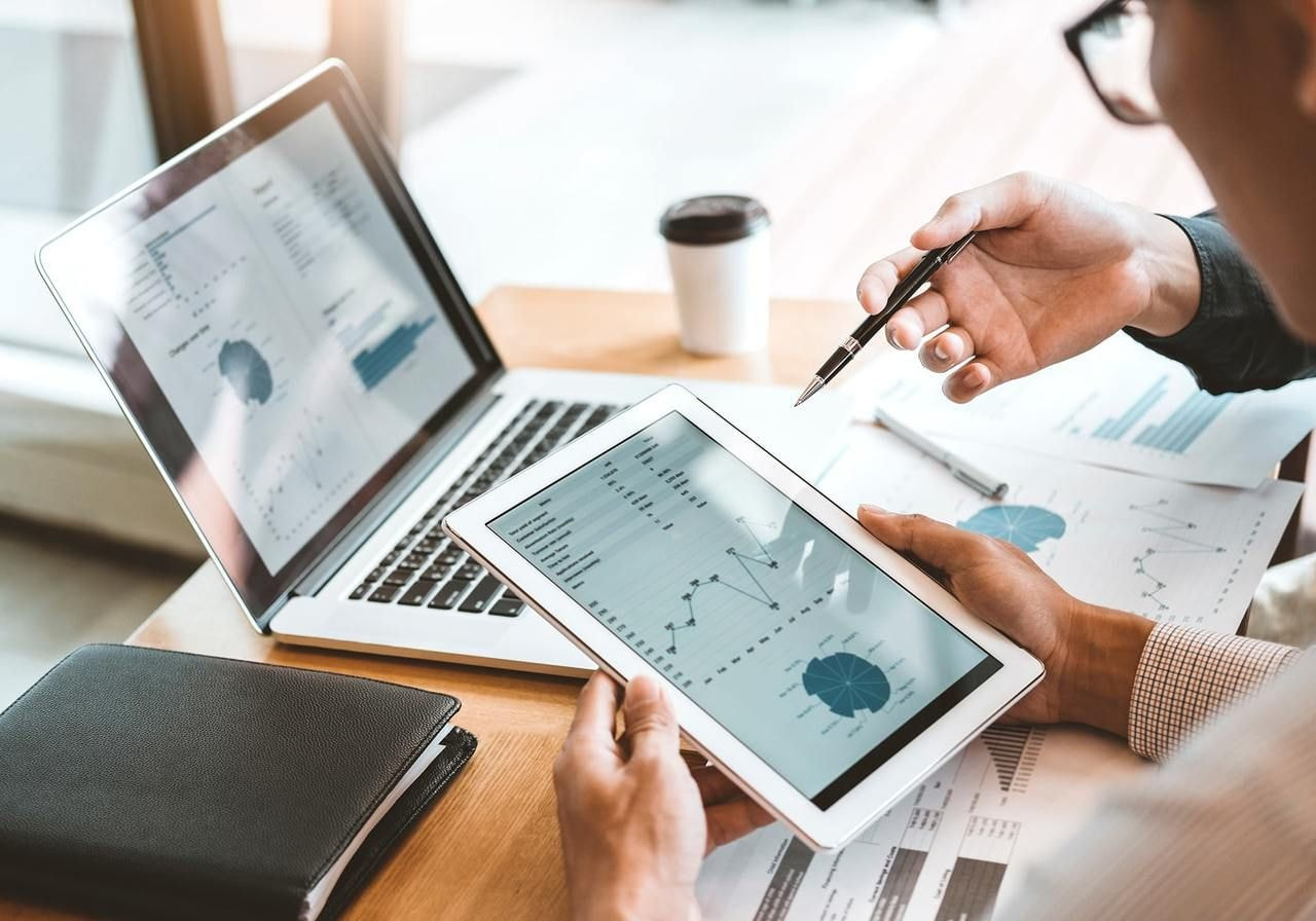 A Person is checking statistics on a tablet.