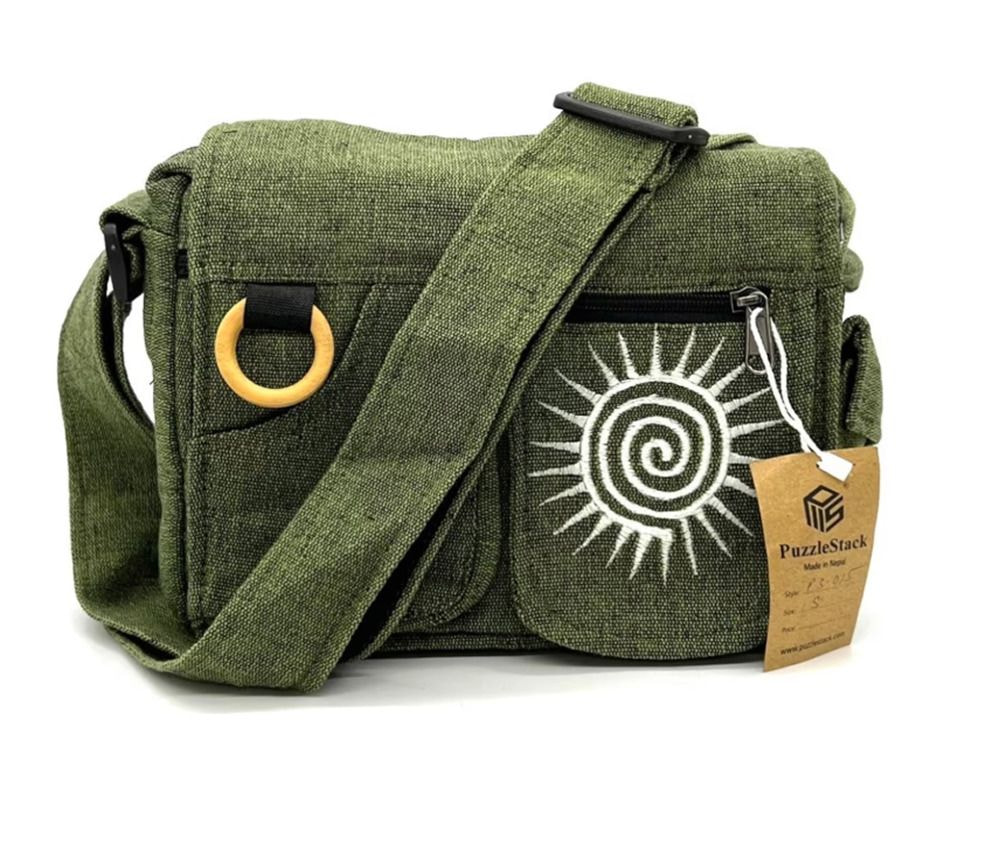 A green messenger bag featuring a bright sun design on the front.