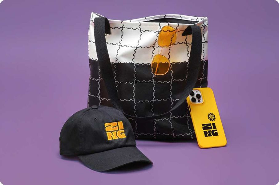 a bag and hat with sunglasses and a phone case