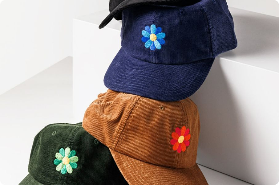 a stack of hats with flowers on them