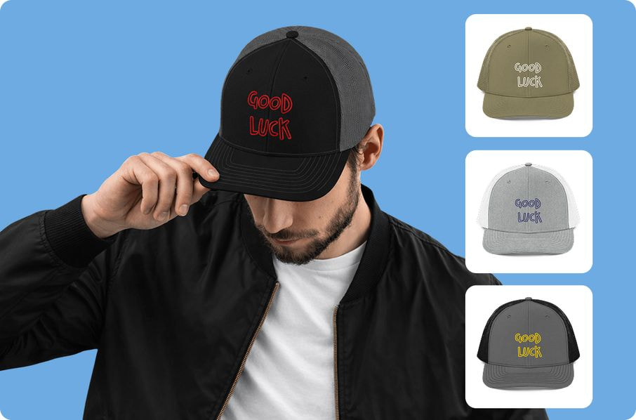 A man wearing a custom black and grey trucker hat with 