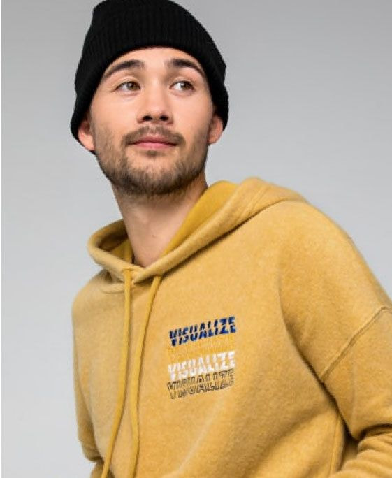 a man in a yellow hoodie