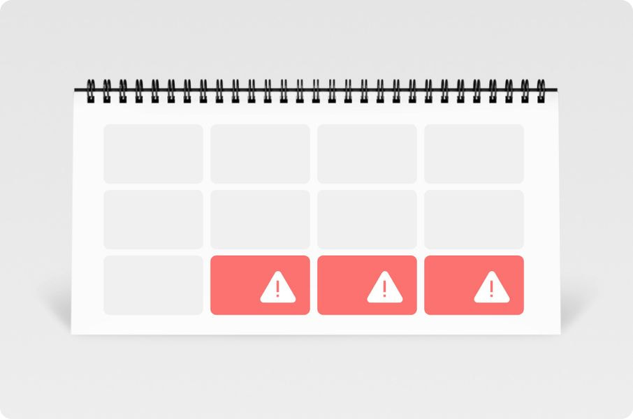 a spiral bound calendar with a red and white triangle icons