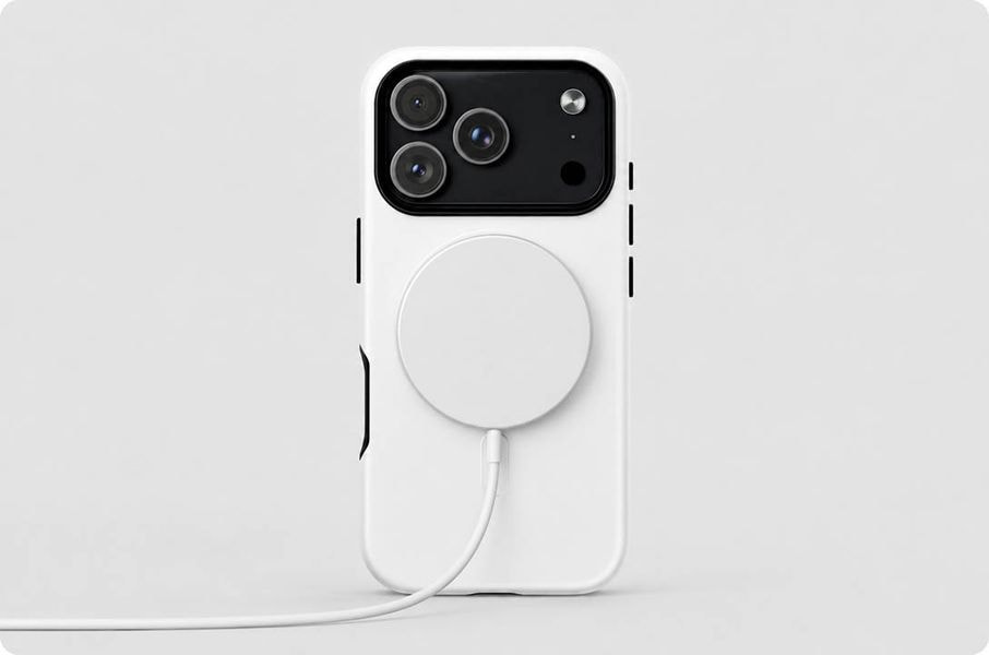 White MagSafe phone case shown with a magnetic wireless charger attached, highlighting compatibility with magnetic charging accessories and custom design printing.